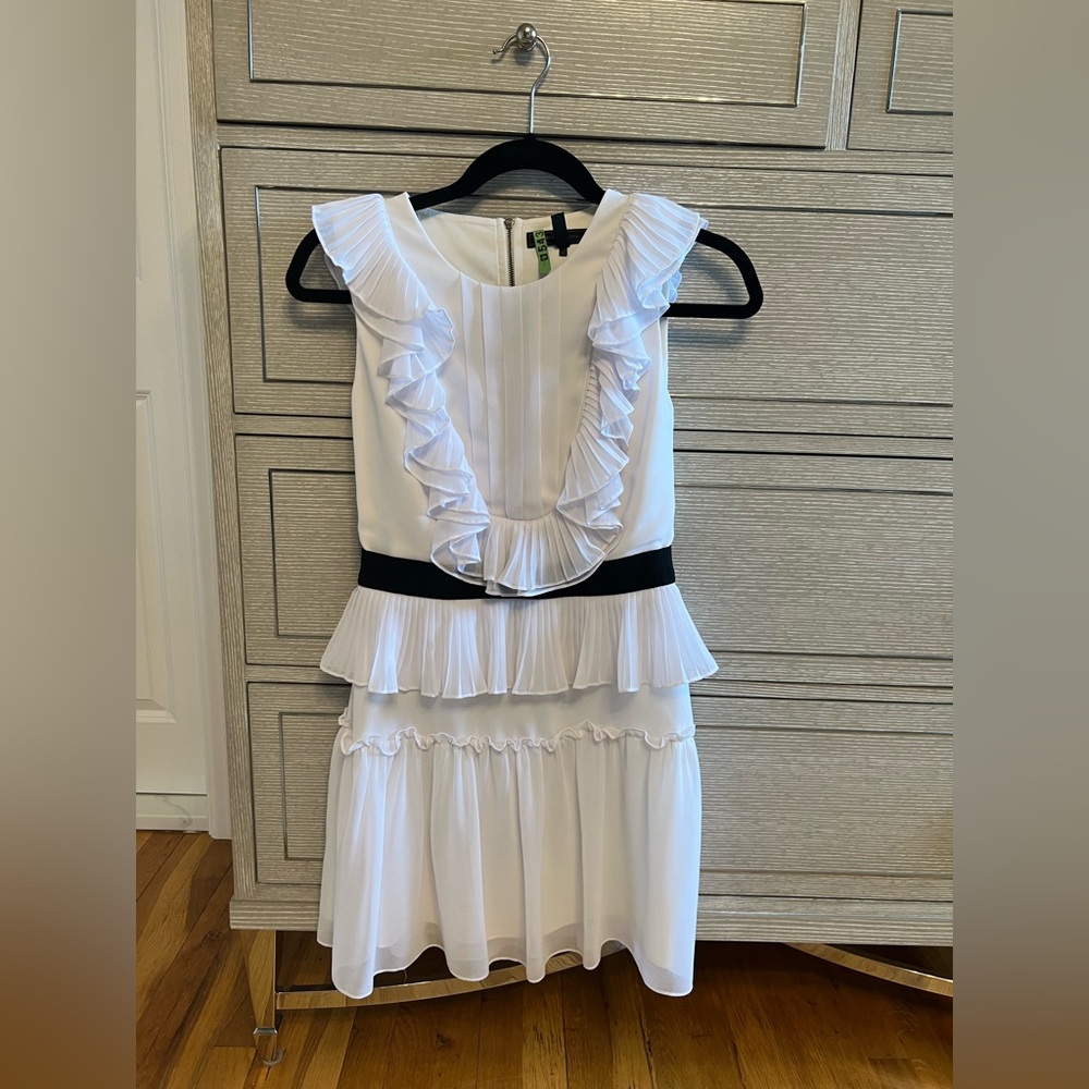 White BCBGMaxAzria mini-dress with semi-open back and black details